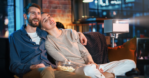 Enjoying the immersive movie night with your lover.